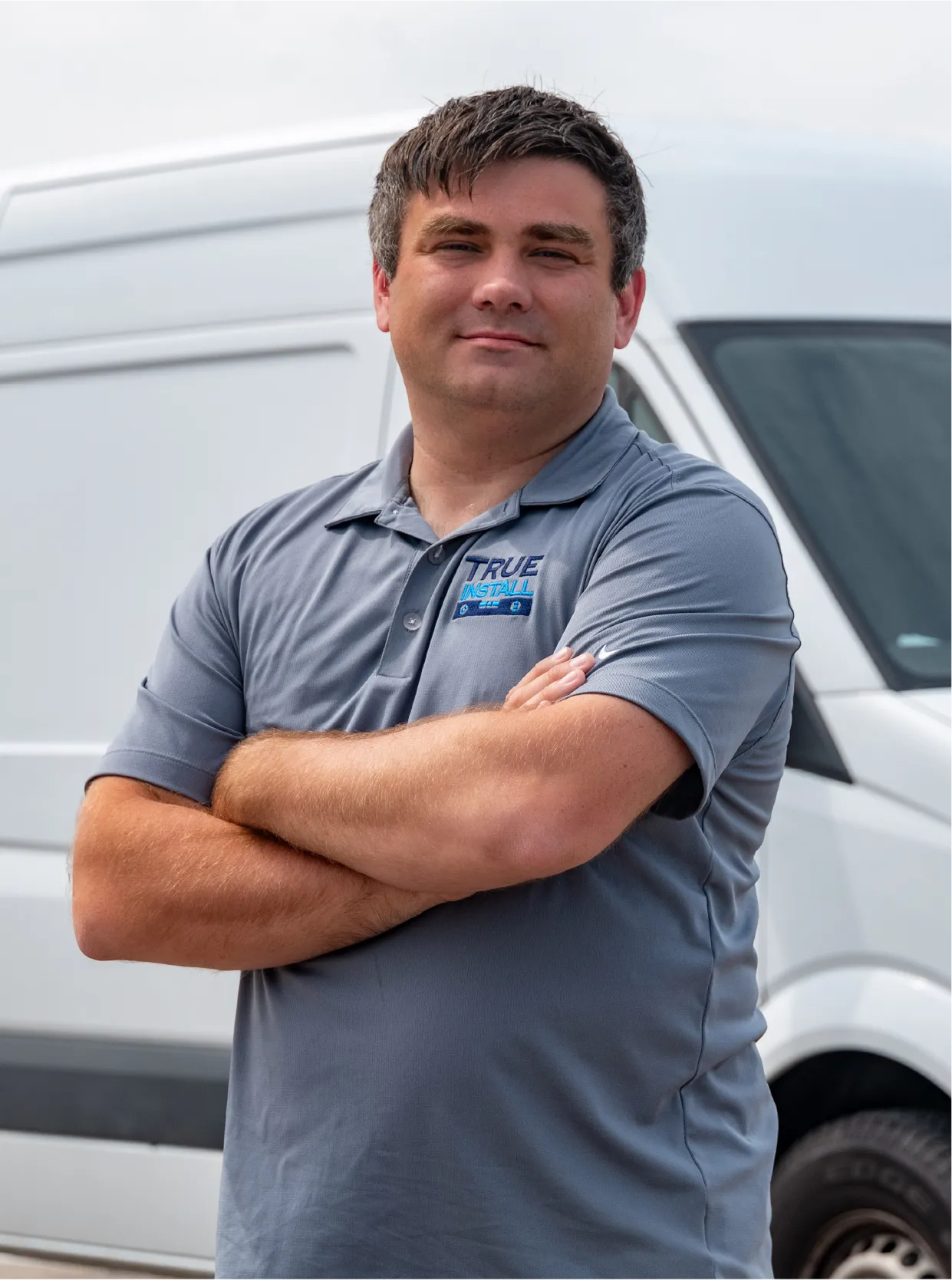 Franchise owner infront of van